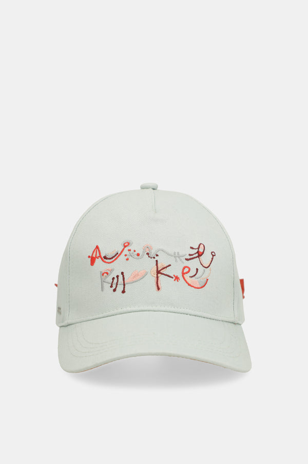 Green cap with red bow