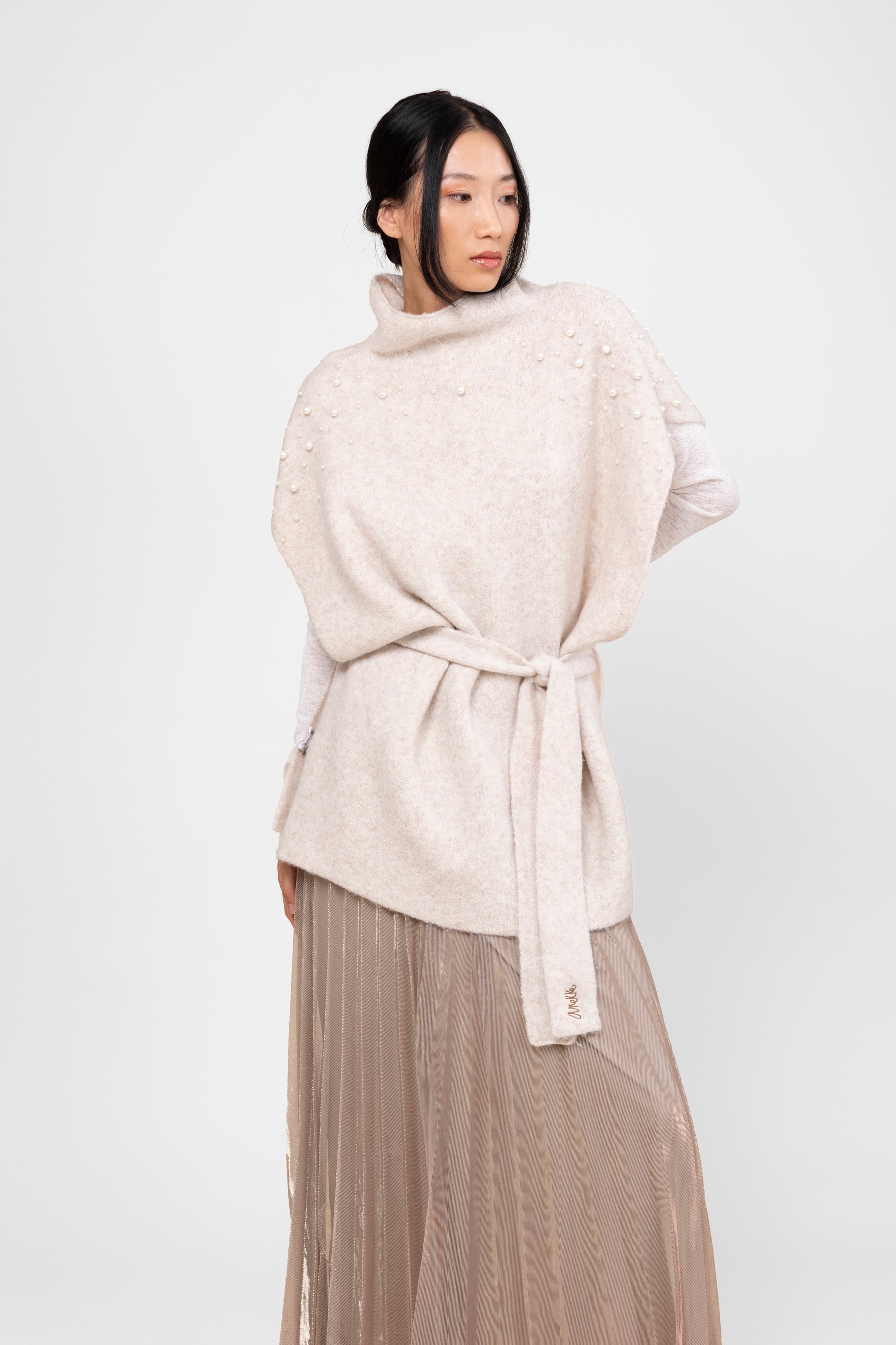 Off-white turtleneck poncho with belt